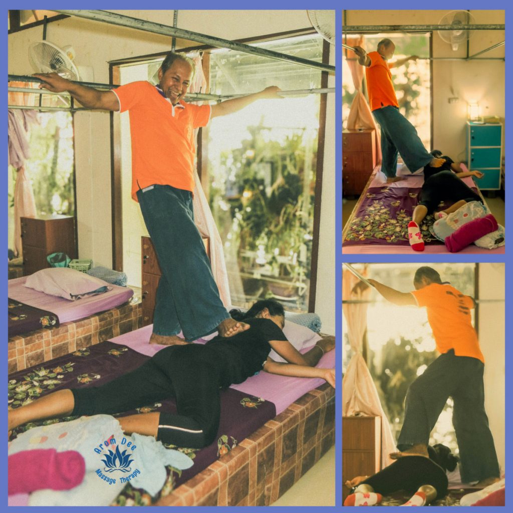 Male massage Thai therapist using feet to massage female's back